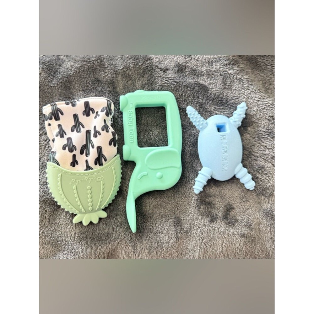 Itzy ritzy teething mit, the baby toon spoon, and molar magician bundle